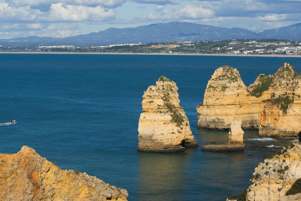 Stunning view of Praia Dona Ana's cliffs in Lagos, Portugal overlooking the Atlantic Ocean.